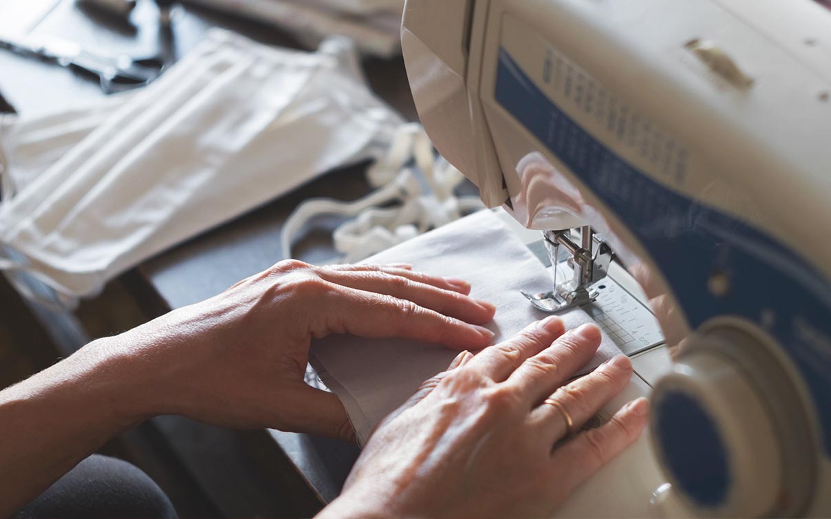 Woman sewing coronavirus mask