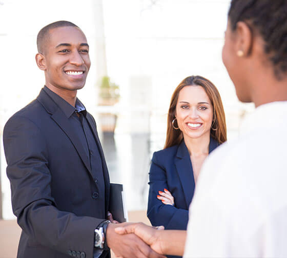 Smiling business people shaking hands